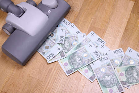 Vacuuming money polish money - PLN currencyの写真素材