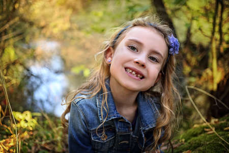 Young girl without a front toothの写真素材