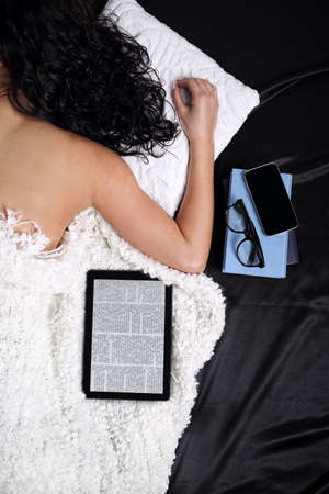 Tired girl sleeping after a hard dayの写真素材