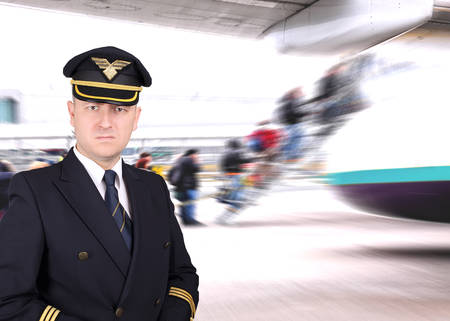 Upset pilot waiting for the departure at the airportの写真素材