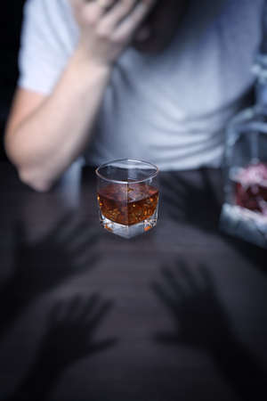 Alcoholism - a man tormented by remorseの写真素材