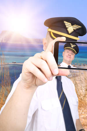Pilot doing selfie in summer vacation spotの写真素材