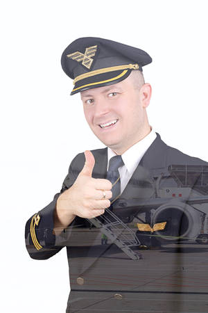 Smiling pilot with his thumb up with the effect of double exposureの写真素材
