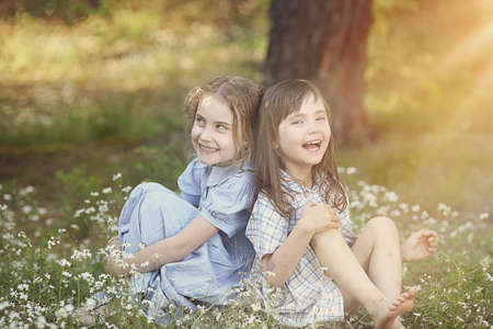 summer friendship - the two amused young girlsの写真素材