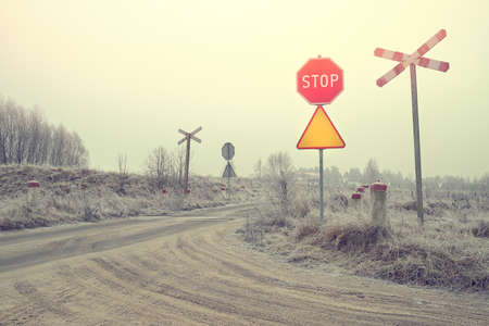 Winter rural landscape and unguarded railway crossingの写真素材