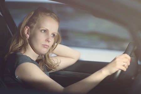 Lonely woman drives a car