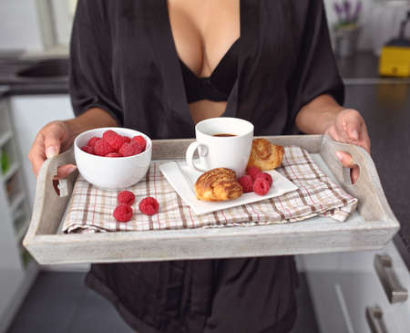Healthy and delicious breakfast - raspberries with coffee and croissantの写真素材