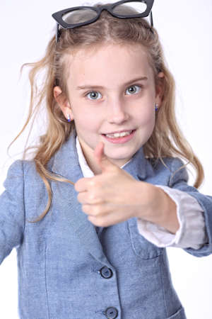 Happy young student shows thumb upの写真素材