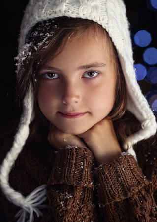 Pensive young girl in winter moody eveningの写真素材