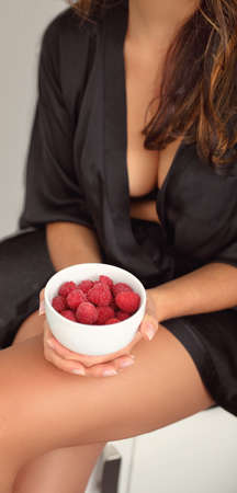 woman with healthy raspberries