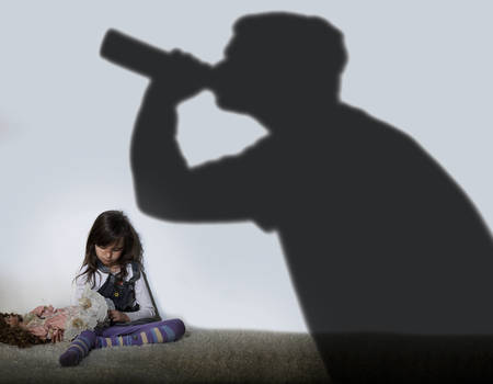 Alcoholic parent and sad childの写真素材