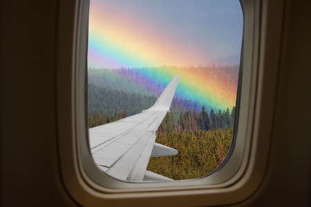View from airplane window on rainbowの写真素材