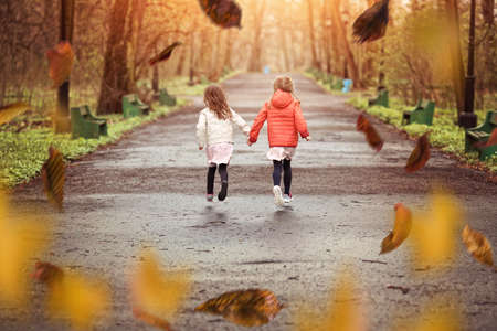 Young friends walk in the park