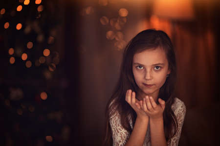 Young and happy girl in Christmas Eveの写真素材