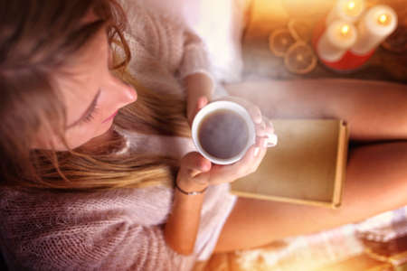 warm tea and book on a winter dayの写真素材