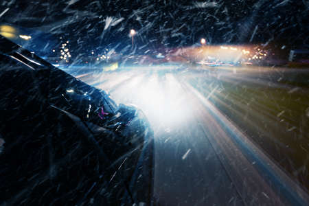 Winter snowfall on the roadの写真素材