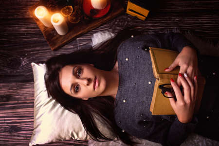 young and cute girl relaxing at the bookの写真素材