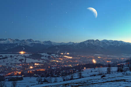 Night view of the mountain townの写真素材