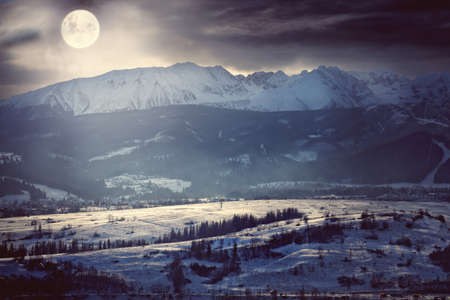 moonlit night over the Polish zakopane cityの写真素材