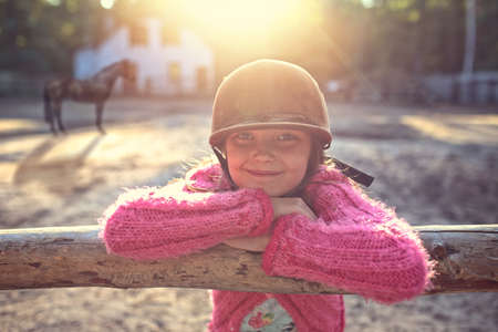 joyful girl in the stableの写真素材