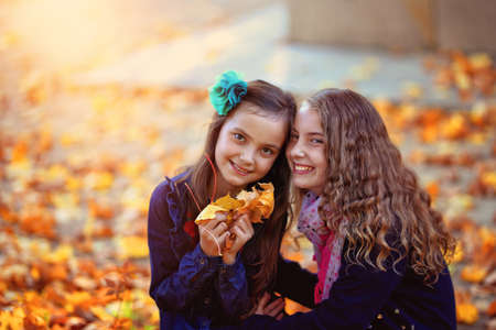 happy little girls on an autumn day