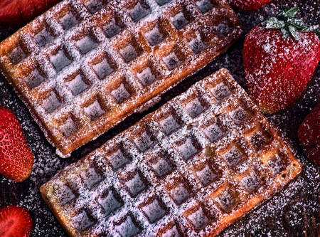 baked waffles with sprinkles and fruitの写真素材