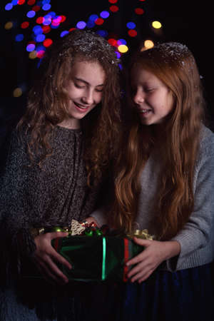 Young friends have fun and laugh on a winter dayの写真素材