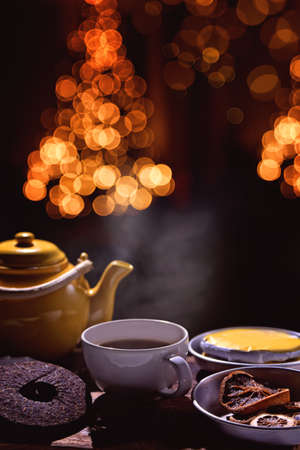 brewing tea in a festive christmas backgroundの写真素材