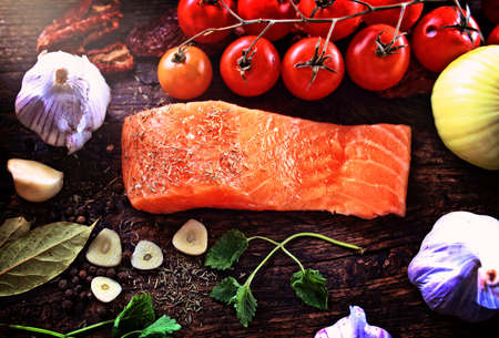 healthy fish salmon with vegetables and garlicの写真素材