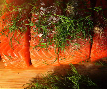healthy and delicious salmon in the kitchen with spicesの写真素材