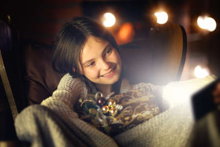 teenager takes a selfie with a christmas gift