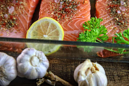 Delicious salmon with spices and garlicの写真素材