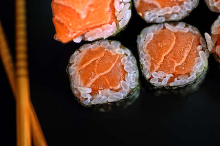 delicious piece of sushi with salmon and mangoの写真素材
