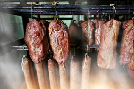 ham and sausages in a smokehouseの写真素材