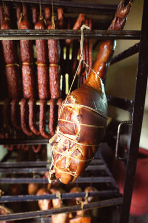 ham and sausages in a smokehouse