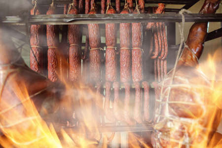 ham and sausages in a smokehouseの写真素材