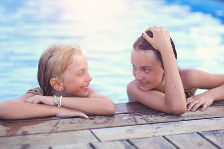 girlfriends friends have fun in the pool on a summer summer holiday dayの写真素材