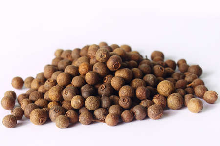 aromatic allspice on a white backgroundの写真素材
