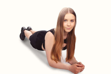 Young girl in fit outfit doing plank exerciseの写真素材