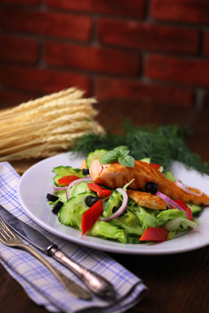 Delicious grilled salmon served with saladの写真素材