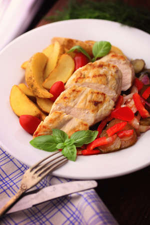 delicious grilled chicken breast served with grilled vegetablesの写真素材