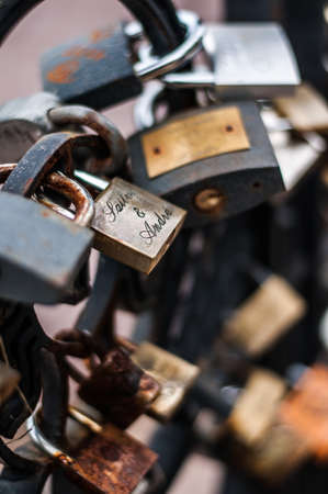 Rusty love locks on iron gateの写真素材