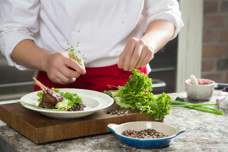 Food decoration on wooden table chief presents medium rare lamb ribs food decoration lamb ribsの写真素材
