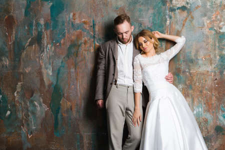 Portrait of young couple in love posing at studioの写真素材