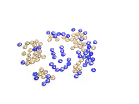 shiny glass pebbles form a smiley face, isolated on white                     