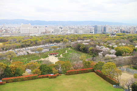 Arial view of sky, mountains, buildings, trees, and fields in Osaka, Japanのeditorial素材