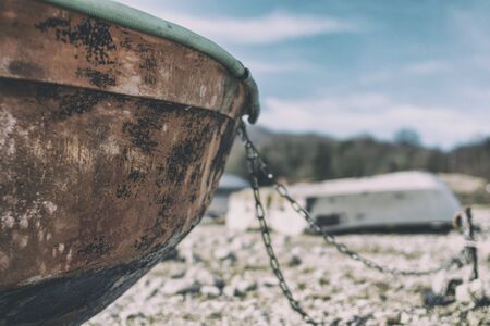 Vintage boat on the beach with beautiful background landscape, Italyの写真素材