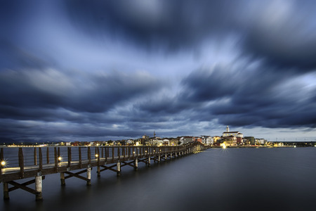 Beautiful and peaceful lansape with pier on blue lakeの写真素材