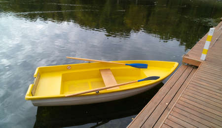 Yellow pleasure boat in the pond. Rowing boat.の写真素材