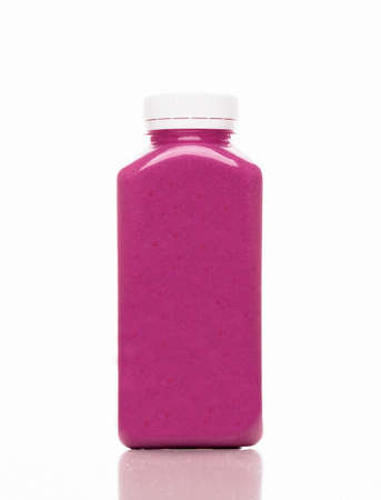 Cold-pressed violet blueberry and cranberry juice for detoxification on a white background. Juice made of organic fruits and vegetables. Clean nutrition, weight loss, healthy eating concept.の写真素材